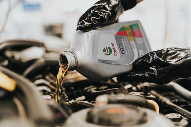 orange holden with bonnet open