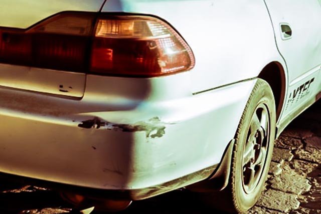 orange holden with bonnet open
